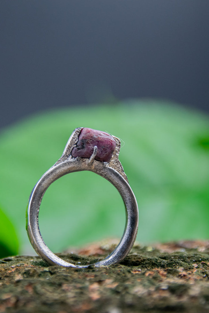 Unique raw ruby ring crafted with sand casting technique, showcasing organic textures and irregular shapes.