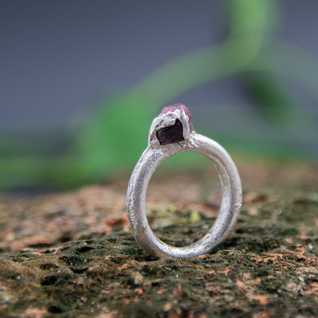Stunning raw ruby round ring crafted through sand casting, showcasing unique textures and organic shapes.