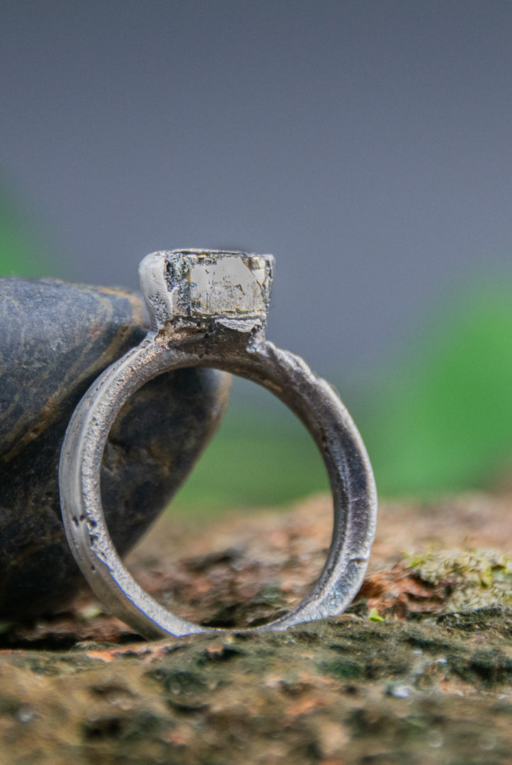 Unique pyrite gemstone ring showcasing organic textures from sand casting technique.
