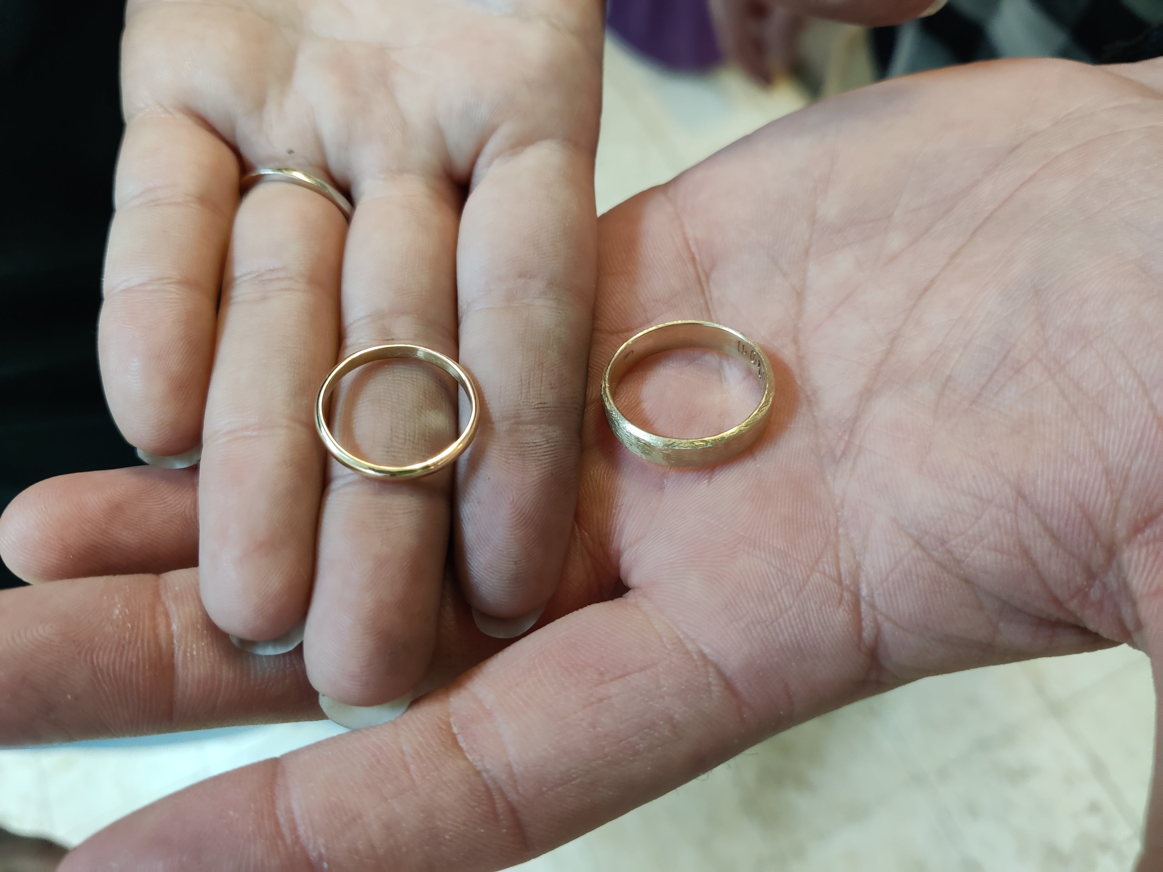 Handmade gold rings shown by couple during wedding ring workshop in Koh Chang.