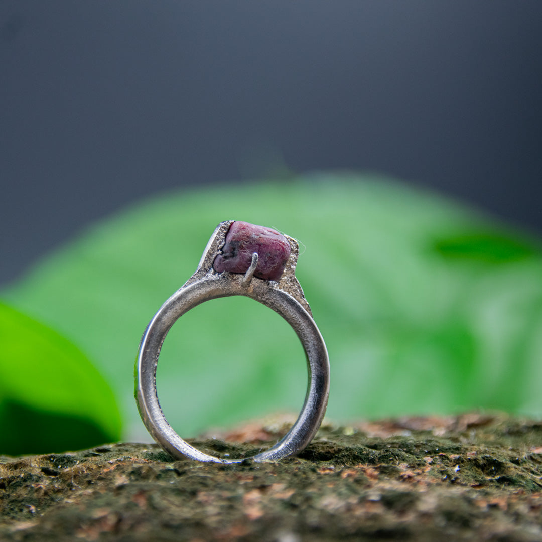Unique raw ruby ring crafted with sand casting technique, showcasing organic textures and irregular shapes.